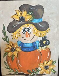 Scarecrow in a pumpkin